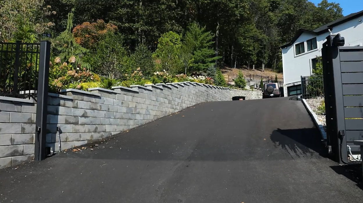 Open metal sliding automated driveway gate