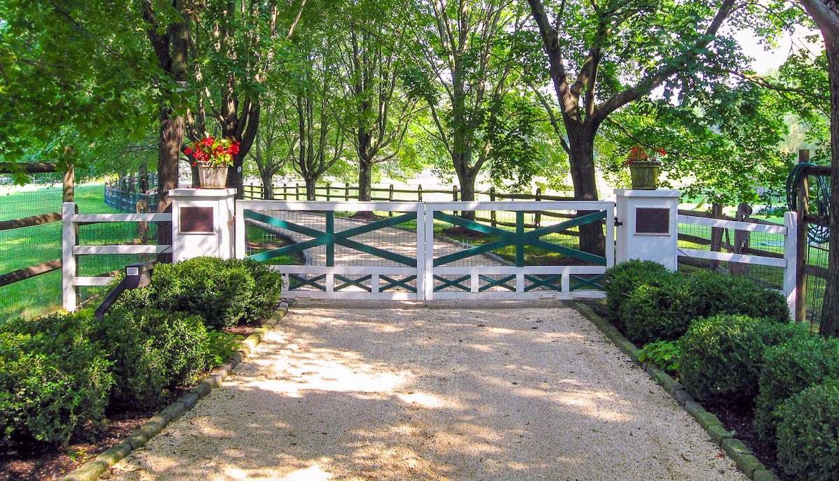 Green and white farm style driveway gate